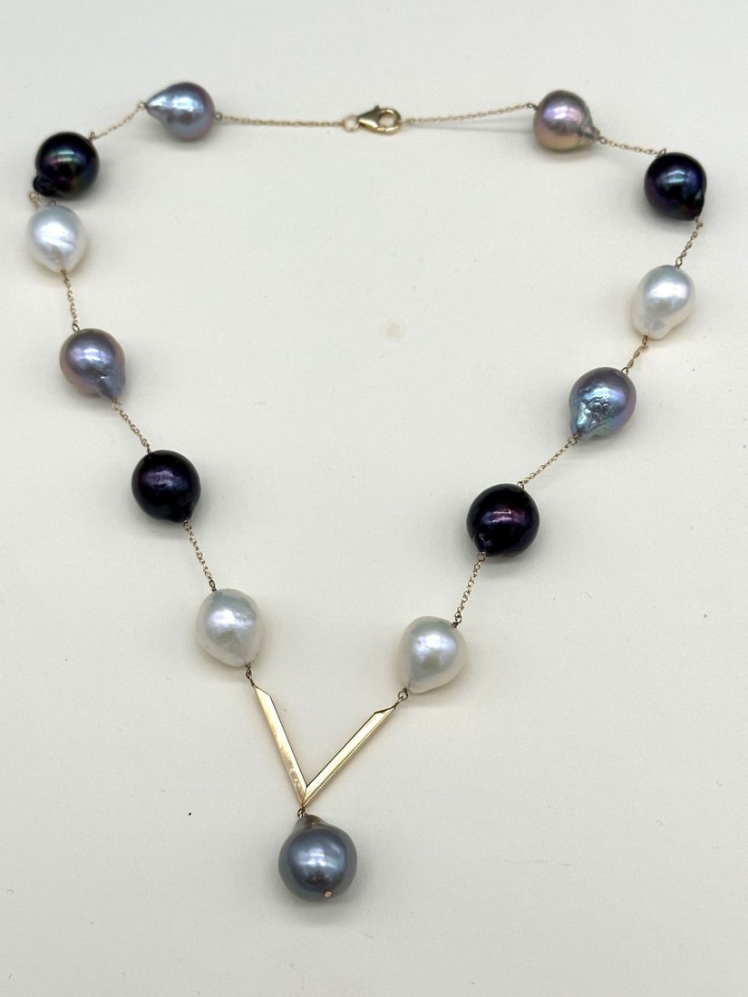 14k Gold and Baroque Pearl Necklace: 14k Gold and Baroque Pearl Necklace: 16" with drop "V" pendant.