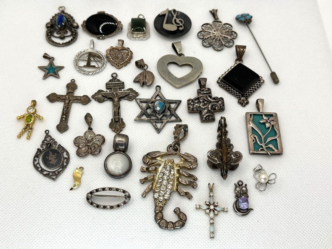 Group of Sterling Silver Pendants and Brooches: Group of Sterling Silver Pendants and Brooches: Total weight is 159.4 grams. Includes 24 pendants, 2 brooches, and 1 pin.