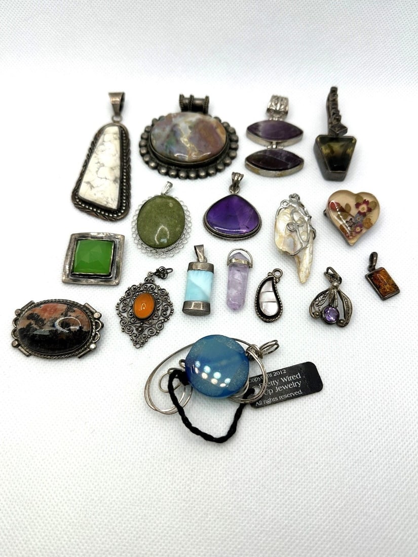Group of Sterling Silver Jewelry: Group of Sterling Silver Jewelry: 14 pendants, 1 clip, and 3 brooches.