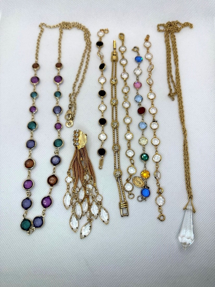 Group of Costume Jewelry: Group of Costume Jewelry: Includes 2 necklaces, 1 brooch pendant drop, 5 bracelets.