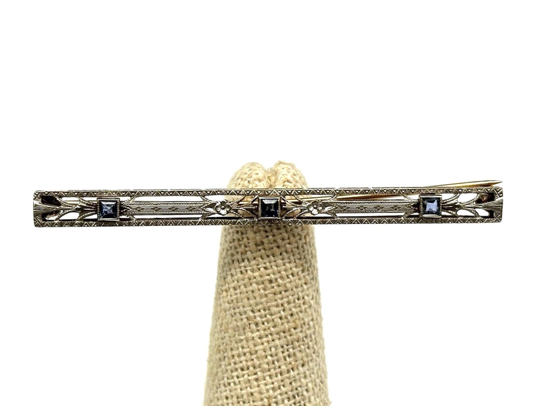 14k Yellow Gold, Platinum & Sapphire Bar Brooch: 14k Yellow Gold, Platinum & Sapphire Bar Brooch: (3) natural synthetic sapphires .14 carats. Total weight of brooch is 4.23 grams. Comes with certified appraisal.