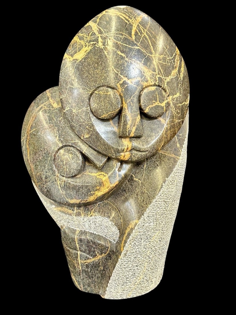 African Soapstone/Butter Stone Sculpture: African Soapstone/Butter Stone Sculpture: Measuring 9.25" tall.