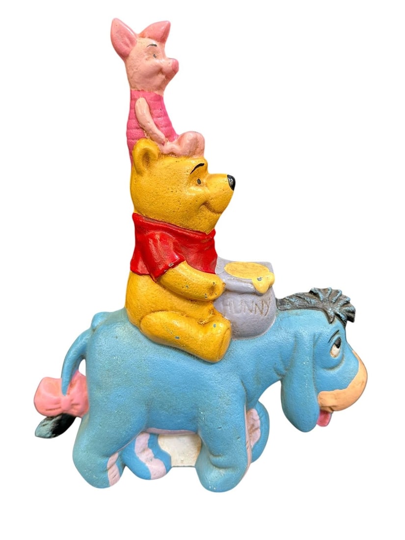 Walt Disney Winnie the Pooh Cast Iron Door Stop: Walt Disney Winnie the Pooh Cast Iron Door Stop: Measures 8.25" tall.