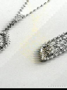 14k White Gold And Diamond Pendant With 14k Chain COA: 14k White Gold And Diamond Pendant With 14k Chain COA: 46 round brilliant cut diamonds. Total diamond weight is .83 carats. Diamond clarity is VS2, diamond color is I. Chain measures 17" long. Comes w