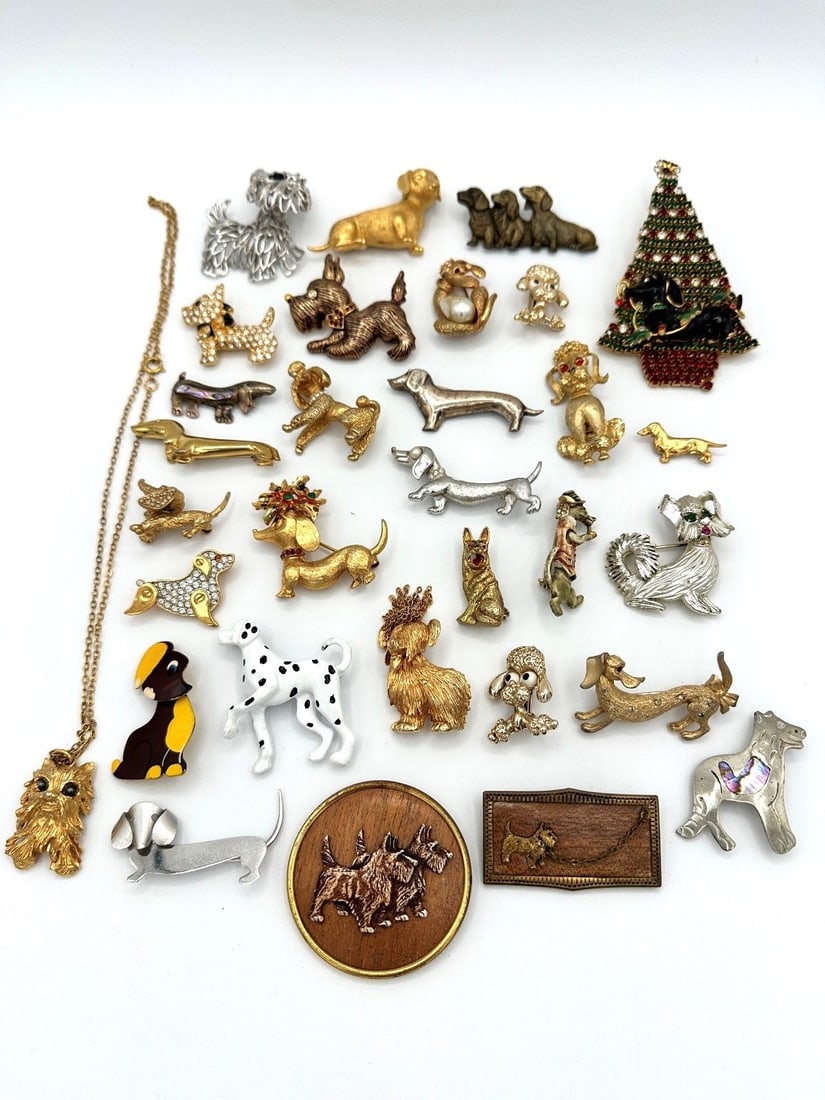 Group of Vintage Signed Dog Brooches; Beau Sterling, Ciner, Crown Trifari: Group of Vintage Signed Dog Brooches: Includes Parklane, Monet, Sterling, Napier, Ciner, Crown Trifari, Czech, Liz Claiborne, Sphinx, Beau Sterling, MYLU, JJ, Matinelli, Kramer, Gerry's, Mamselle, HAR