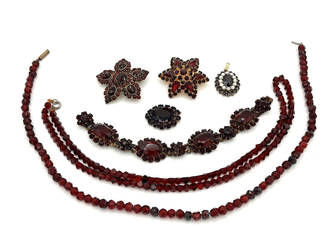 Group of Vintage Garnet Jewelry: Group of Vintage Garnet Jewelry: Includes (2) brooches, (2) pendants, (1) bracelet, (2) necklaces.