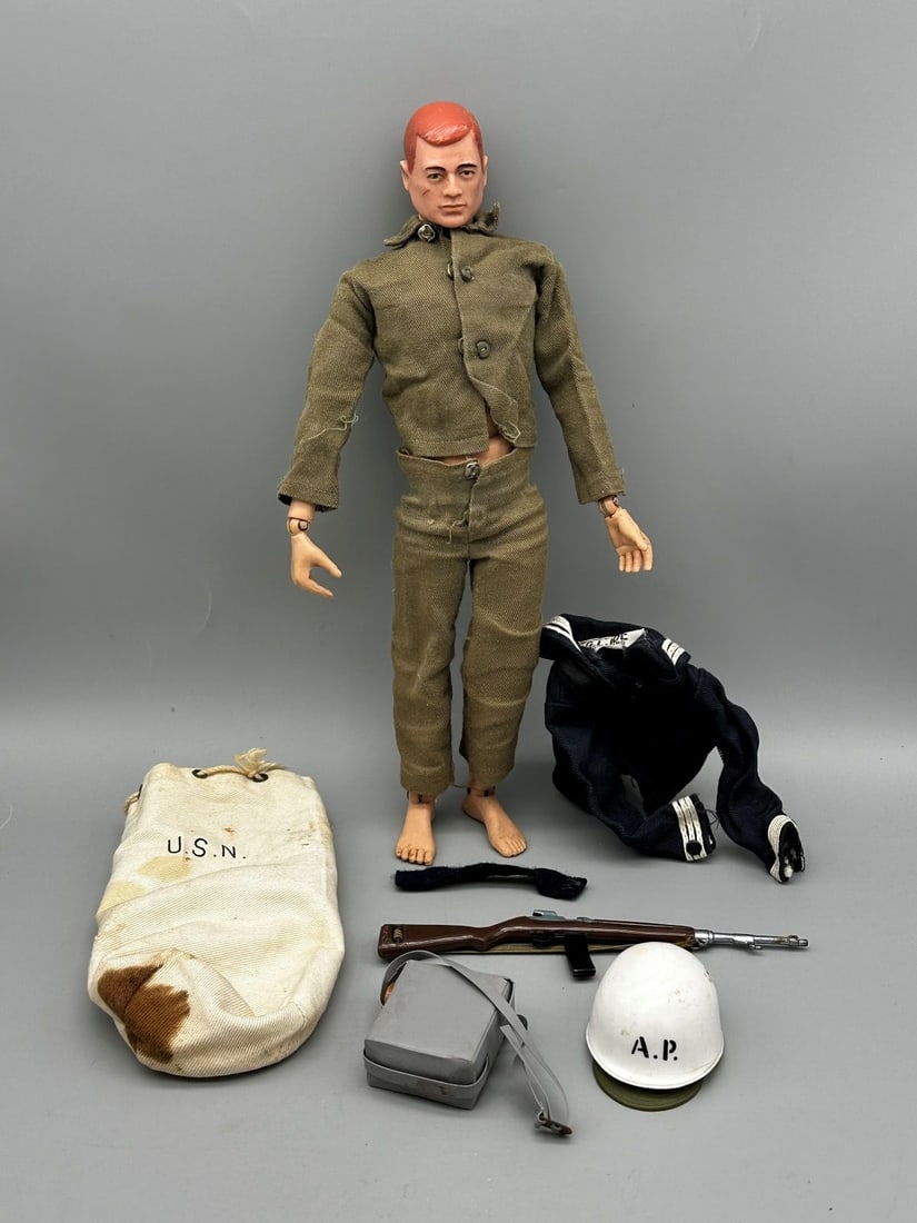 1964 G.I. Joe Doll With Naval & Military Accessories: 1964 G.I. Joe Doll With Naval & Military Accessories: Comes with USN bag, Naval Blue uniform Top, Rifle, AP Hat, Sack.