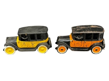 (2) Arcade Yellow/Orange Cast Iron Taxi Cabs