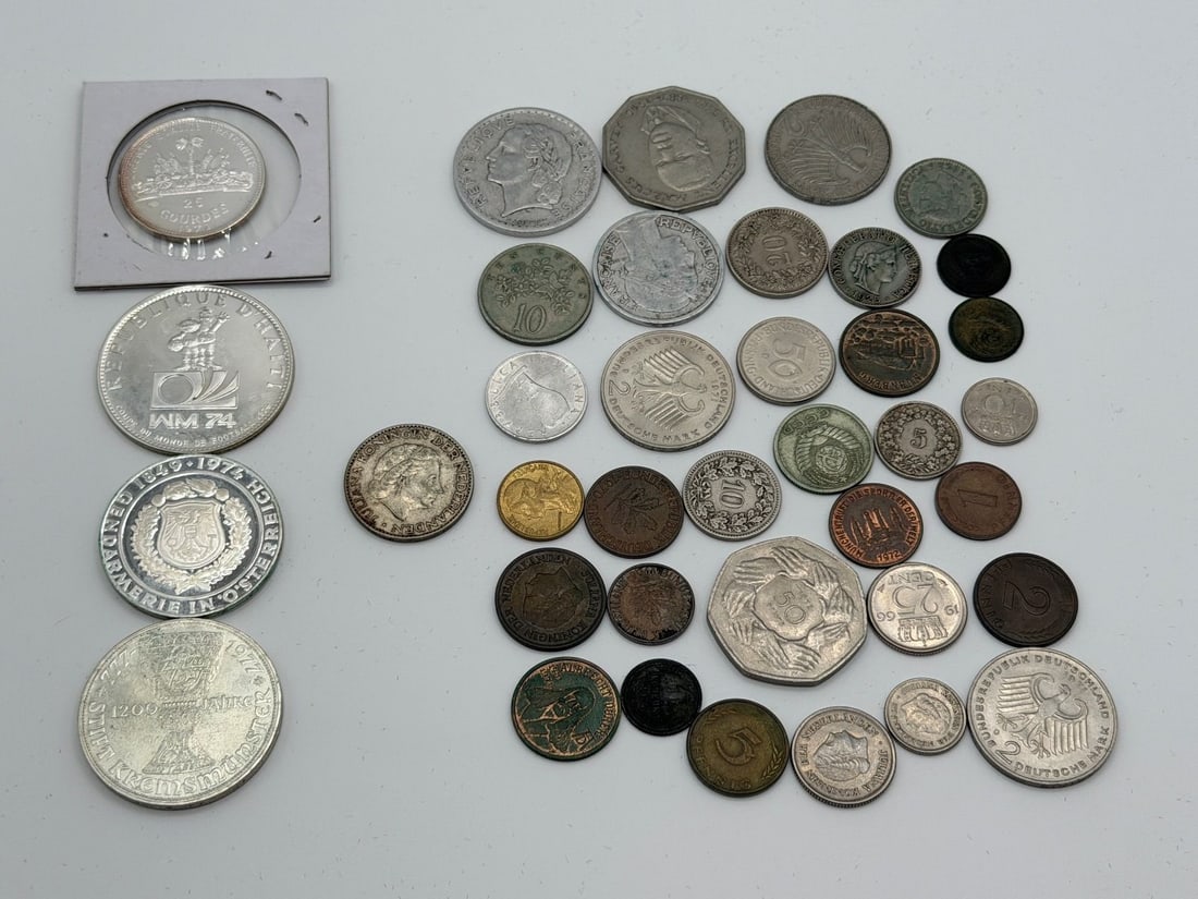 (39) Group of Foreign Coins: Including Silver From Haiti, Austria, Netherlands: (39) Group of Foreign Coins: Including Silver From Haiti, Austria, Netherlands: Includes 1973 Haiti FIFA World Cup in .925, 1974 50 Schilling 125th Anniv. Austrian Police Force .640, 1973 Haiti 25 Gou