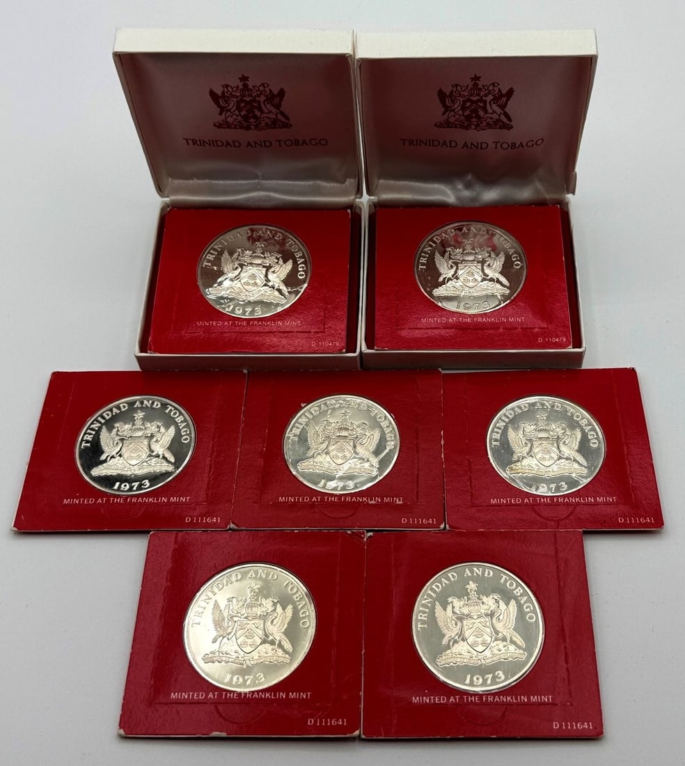 Group of (7) 1973 Trinidad and Tobago Sterling Silver Coins from The Franklin Mint: Group of (7) 1973 Trinidad and Tobago Sterling Silver Coins from The Franklin Mint. Included are (5) 1973 Trinidad and Tobago $5 sterling coins and (2) 1973 Trinidad and Tobago $10 sterling coins with