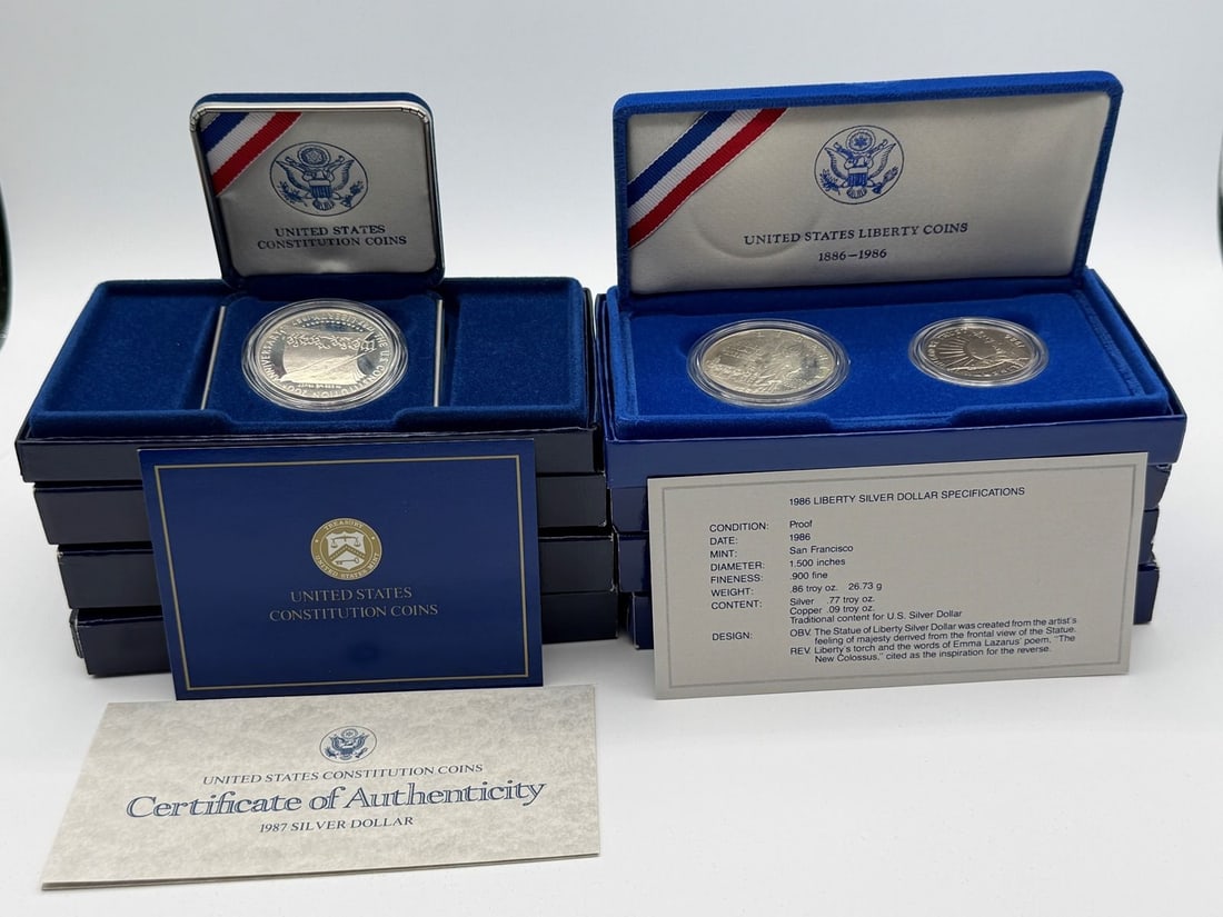 (3) 1987 US Constitution Silver Dollars, (3) 1986 Liberty Silver Dollar and Half Dollar Coins With: (3) 1987 US Constitution Silver Dollars, (3) 1986 Liberty Silver Dollar and Half Dollar Coins With COA's and Boxes: