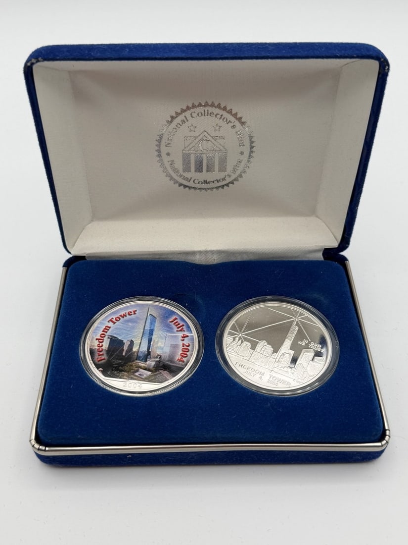 (2) World Trade Center's .999 Silver Round Coins National Collectors Mint: (2) World Trade Center's .999 Silver Round Coins National Collectors Mint: One is colorized. In box and with COA.