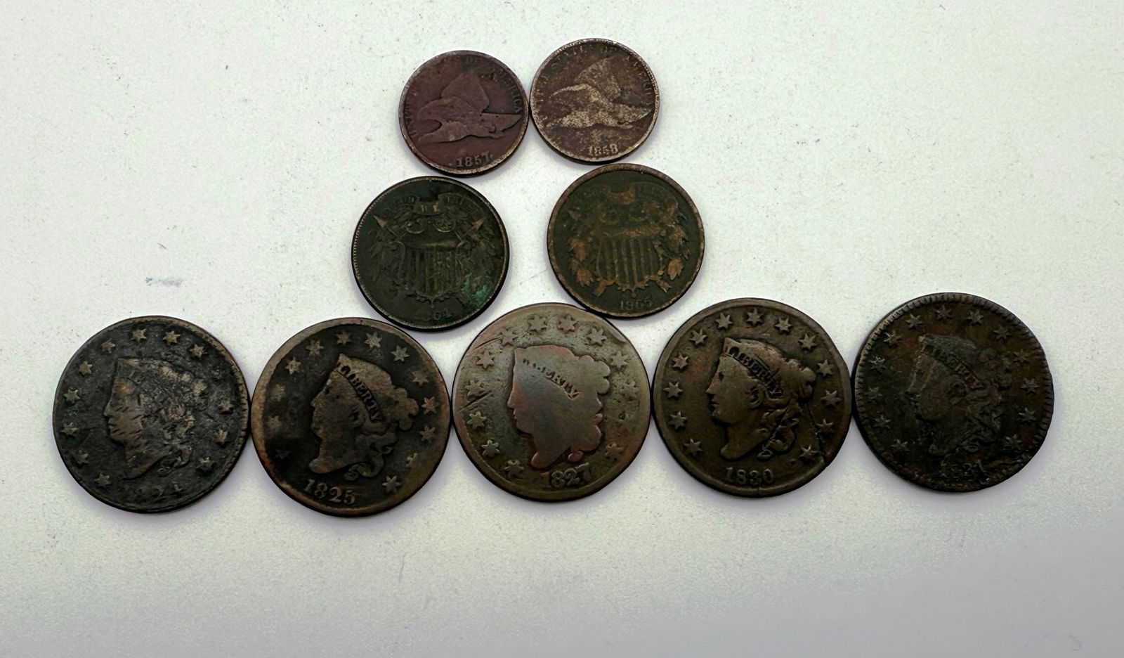 Group of (9) Early US Cents: Group of (9) Early US Cents includes (5) Large Cents dated 1824, 1825, 1827, 1830 and 1831. Also included are (2) 2 Cent Shields dated 1864 and 1865 and (2) Flying Eagle Cents 1857 and 1858.