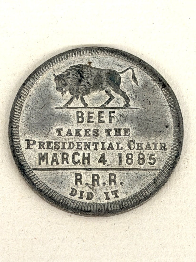 RARE Grover Cleveland White Metal Satirical Inaugural Token 1885: RARE Grover Cleveland Inaugural Token 1885: 1885 Victory and Inauguration by JNT Levick. "Beef Takes the Presidential Chair" 28mm