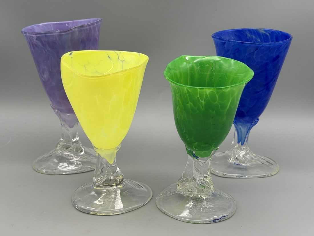 Set of 4 Hand Blown Art Glass Goblets: Set of 4 Hand Blown Art Glass Goblets: In purple, green, blue, and yellow. Measuring 5.5" and 6.5".