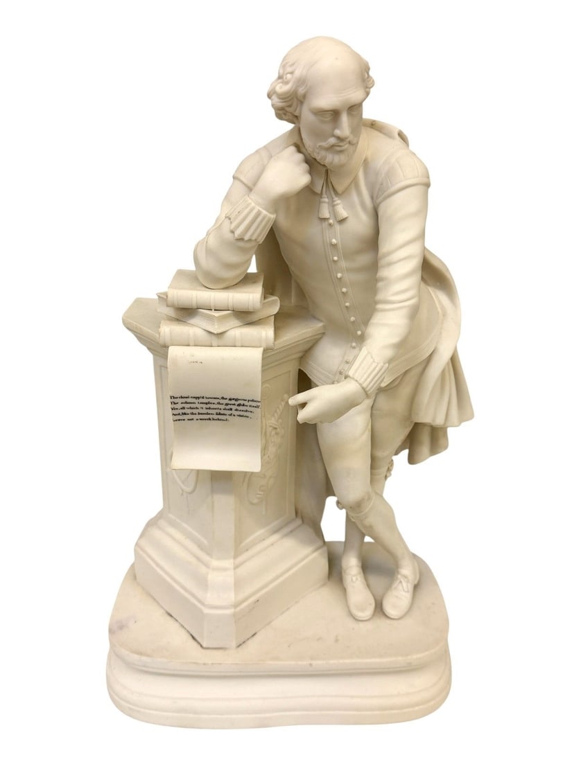 Parian Ware William Shakespeare Sculpture: Parian Ware William Shakespeare Sculpture: Shakespeare leaning on a stack of books atop a pillar. Measures 16.75" tall, base is 9.5 x 5". Finger is broken in front.