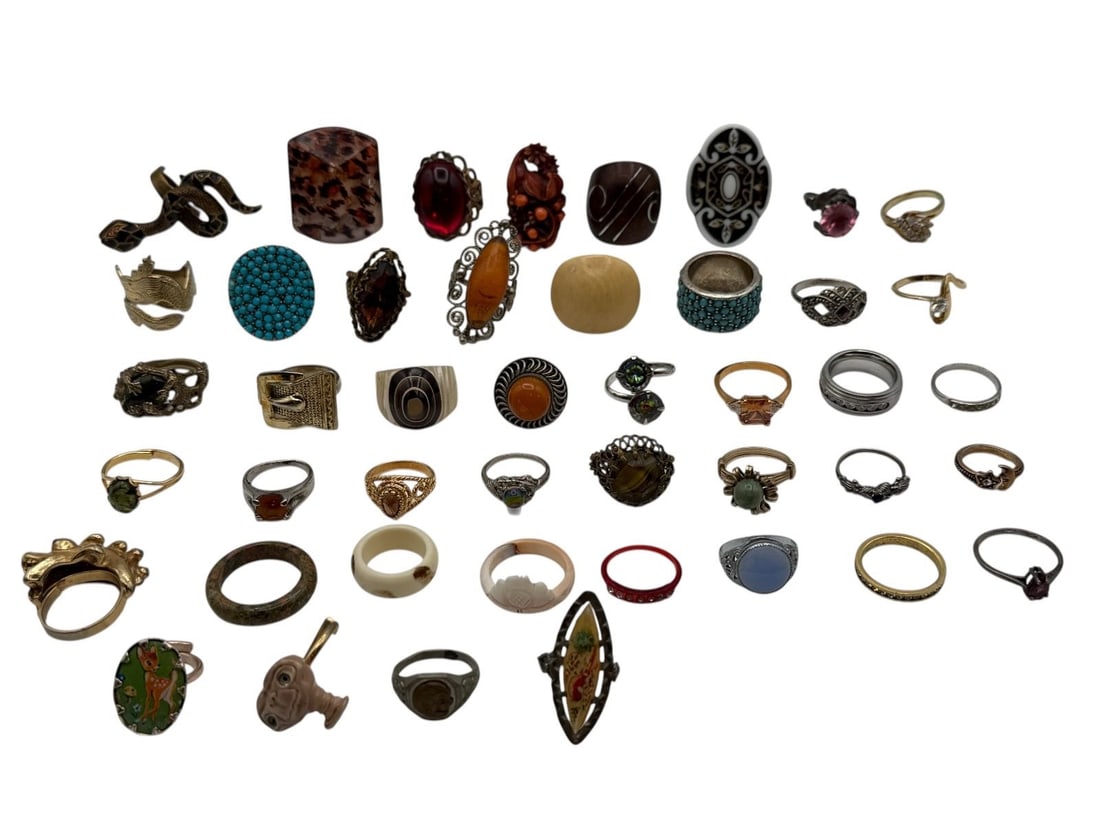 Group of Costume Statement Rings: Group of Costume Statement Rings: Includes carved coral, snake, kion, faux turquoise, gemstones, rhinestones, carved stone, ET, Bambi, amber, Superman "Tim" Club ring cereal premium 1930's.