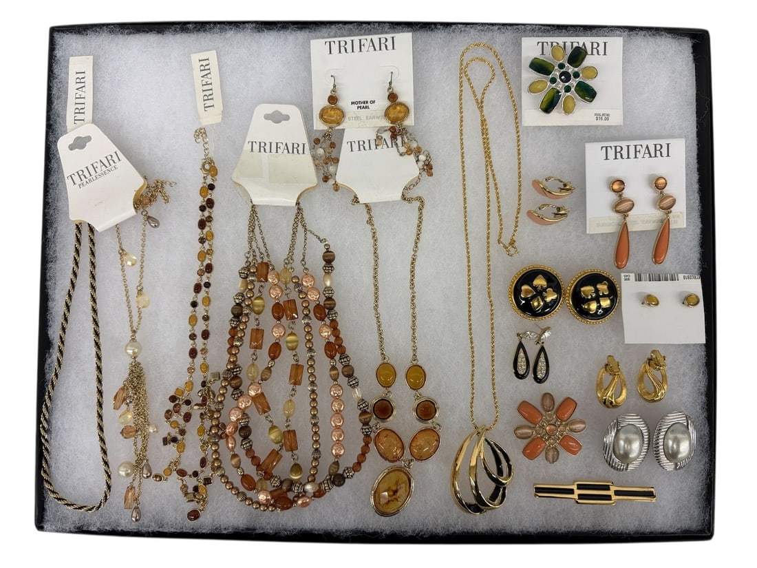 (17) Pieces of Trifari Jewelry: (17) Pieces of Trifari Jewelry: Includes (6) necklaces, one with earrings, (3) brooches, (8) pairs of earrings.