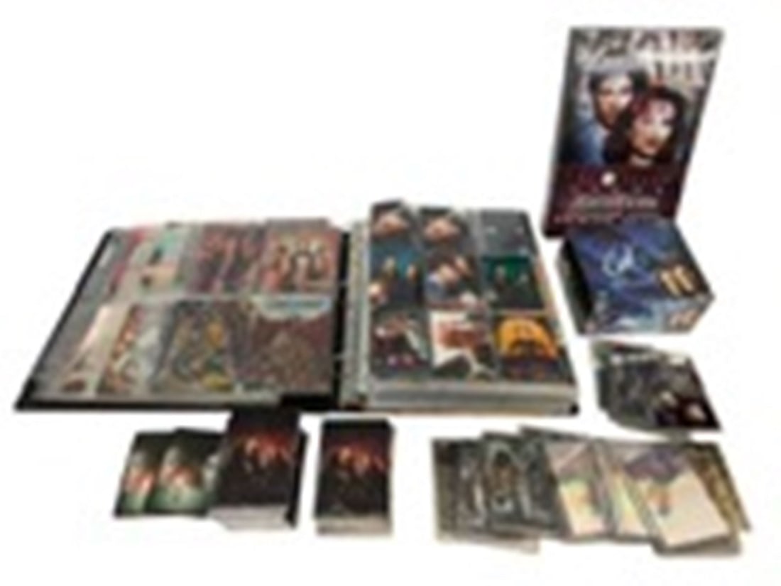 The X-Files Trading Cards Memorabilia Group: The X-Files Trading Cards Memorabilia Group: Includes Topps master visions premiere edition, Fight the Future movie cards, inserts and holograms, Series 1,2,3 foil slogans in binder, (40) VHS video