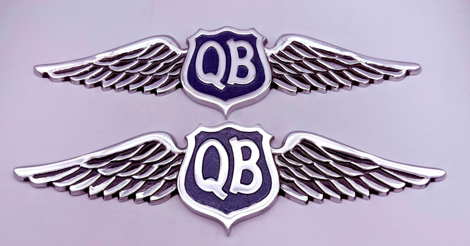 (2) "QB" Quiet Birdman Cast Aluminum Plaques: (2) "QB" Quiet Birdman Cast Aluminum Plaques. Quiet Birdman Fraternal Order of Pilots was founded in 1921. Members were called QB's and invitations had to be extended to join the organization. These p