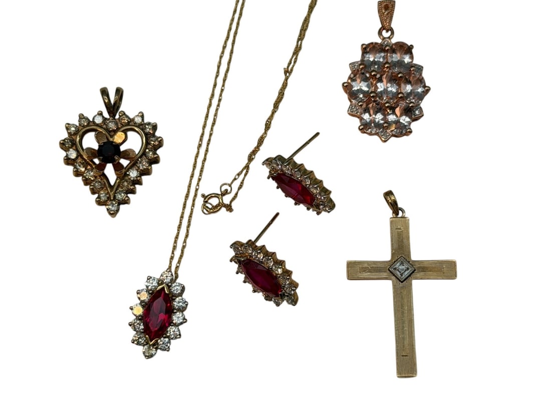 Group of 10k Gold Jewelry: Group of 10k Gold Jewelry: Includes 18" chain with pendant of red moissanite and CZ's and matching earrings. Cross signed Esemco, pendant with CZ's, heart pendant with diamonds. Total weight is 15 gra