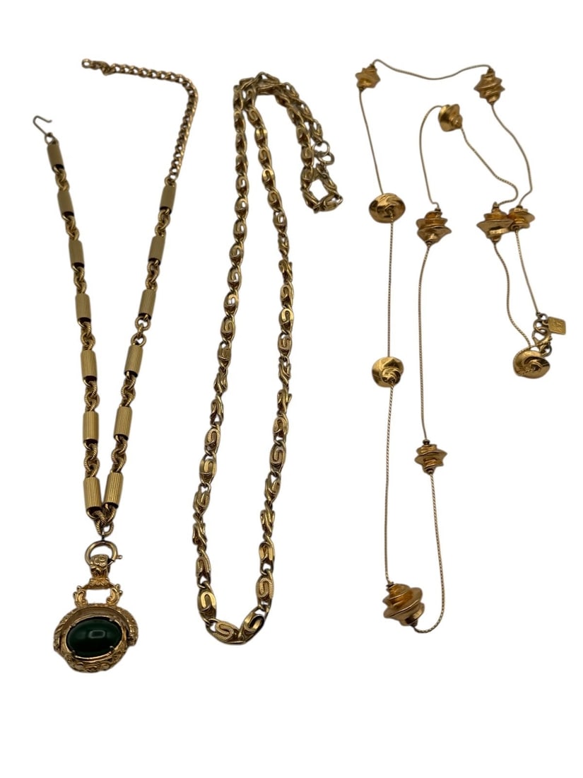 (3) Statement Costume Necklaces: (3) Statement Costume Necklaces: Includes Napoleon Flip Goldette Pendant 21" long, one direction signed fancy gold tone necklace, Anne Klein heavy gold tone rock link 40".