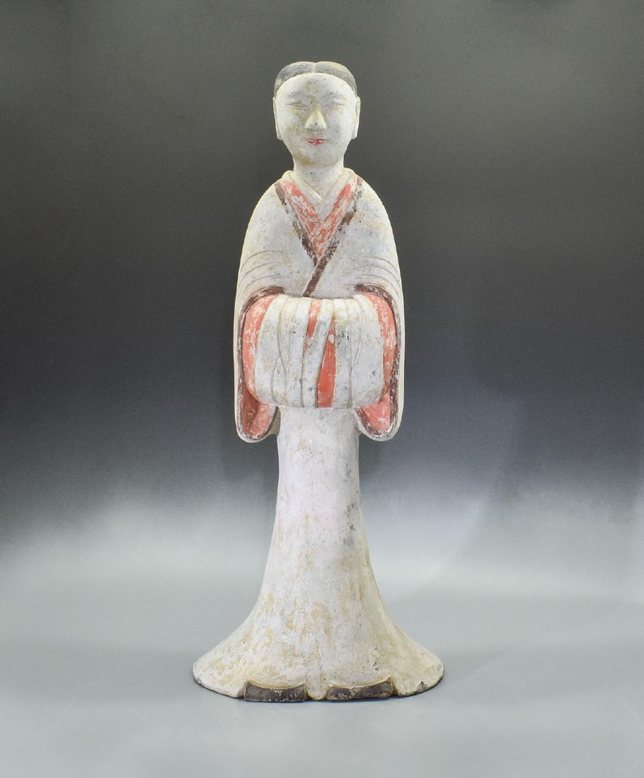 LARGE HAN DYANSTY COURT LADY - TL TESETED - 25": Ca. 200 BC Large Chinese Han Dynasty pottery female attendant holding her arms in front of her body. She is made from light grey earthenware, painted in white, black, and red. The V-Shape opening reve