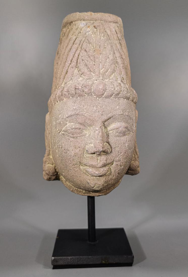 MEDIEVAL CAMBODIAN SANDSTONE FEMALE HEAD: Ca.700 AD. Attractive sand stone Head of Bodhisattva, pre-Angkor Period, Phnom da style. Good Condition, on custom stand; Size: 19cm x14cm x8cm (7.48x5.51x3.14 in); 1kg; Provenance: Private collection