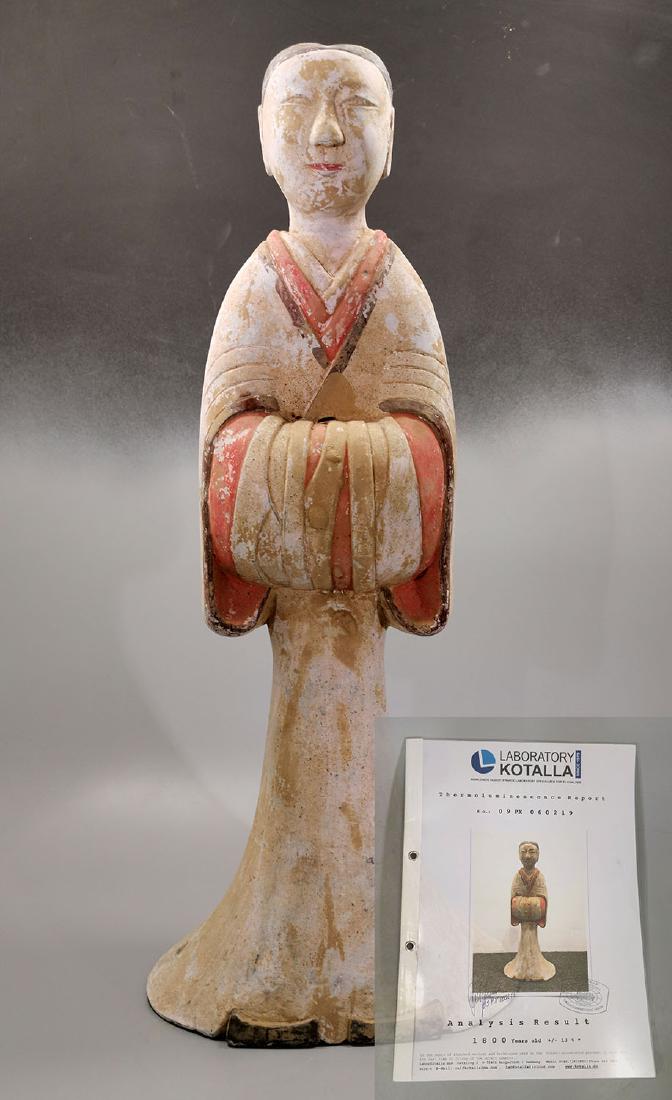LARGE HAN DYANSTY COURT LADY - TL TESTED: Ca. 200 BC. Large Chinese Han Dynasty pottery female attendant holding her arms in front of her body. She is made from light grey earthenware, painted in white, black, and red. The V-Shape opening rev