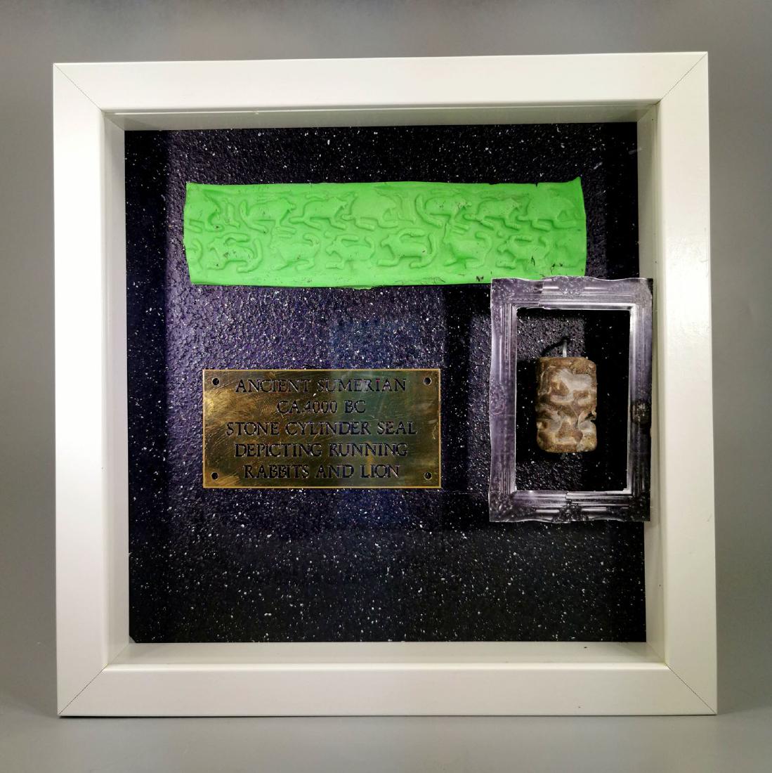 SUMERIAN STONE CILINDER SEAL WITH RUNNING RABBIT AND: Ca.4000 BC. Rare Sumerian stone cylinder seal depicting a running rabbit. With ceramic press and mounted in custom frame. Good Condition; Size frame: 25cm x25cm (9.84 x 9.84 in), Seal size: 3.4cm 725g