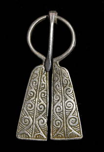 VIKING ERA SILVER PENANNULAR BROOCH WITH TRISKELE: Ca.900- 1100 AD. A fabulous Viking silver cast penannular brooch (fibula) with triskele decoration, This style incorporates the penannular style and enlarges the terminals, expanding them into long,