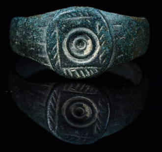 SAXON ERA BRONZE RING WITH EVIL EYE: Ca.700 AD. Wearable Saxon ring with Evil Eye decoration; Many cultures believe that receiving the evil eye will cause misfortune or injury, while others believe it to be a kind of supernatural force