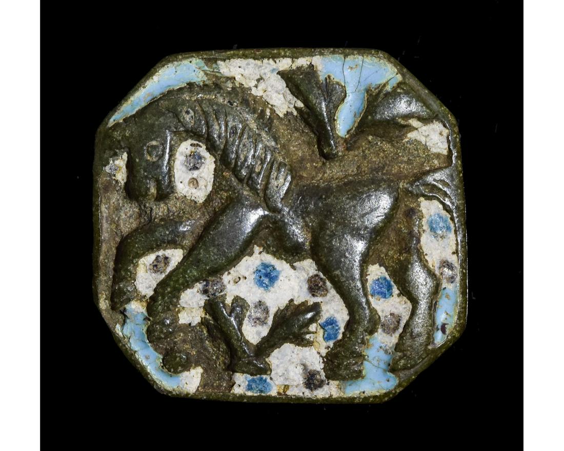 TUDOR ERA BRONZE BELT MOUNT WITH UNICORN: Ca.1500 AD. Fantastic Tudor period bronze belt applique depicting a unicorn beautifully decorated with its original white and blue glass enamel. Good Condition; Wearable; 31x30mm; 1.18x1.18in; 14gr; P