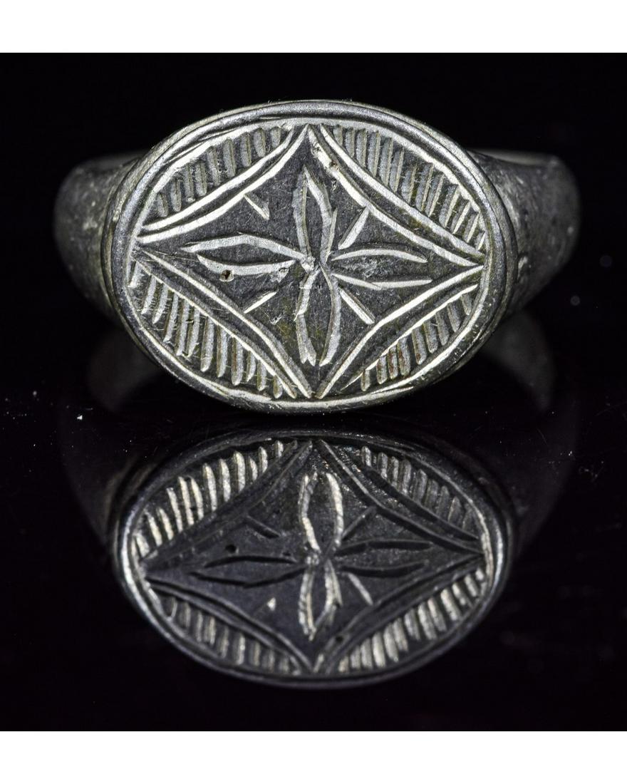 MEDIEVAL ST. JOSEPH SILVER RING WITH FLEUR-DE-LIS: Ca.1200 AD. Important Medieval Silver Ring with with Fleur-de-lis pattern. The "fleur-de-lis" or "fleur-de-lys" is a stylized lily used as a decorative design or motif. It is also a symbol of St. Jose