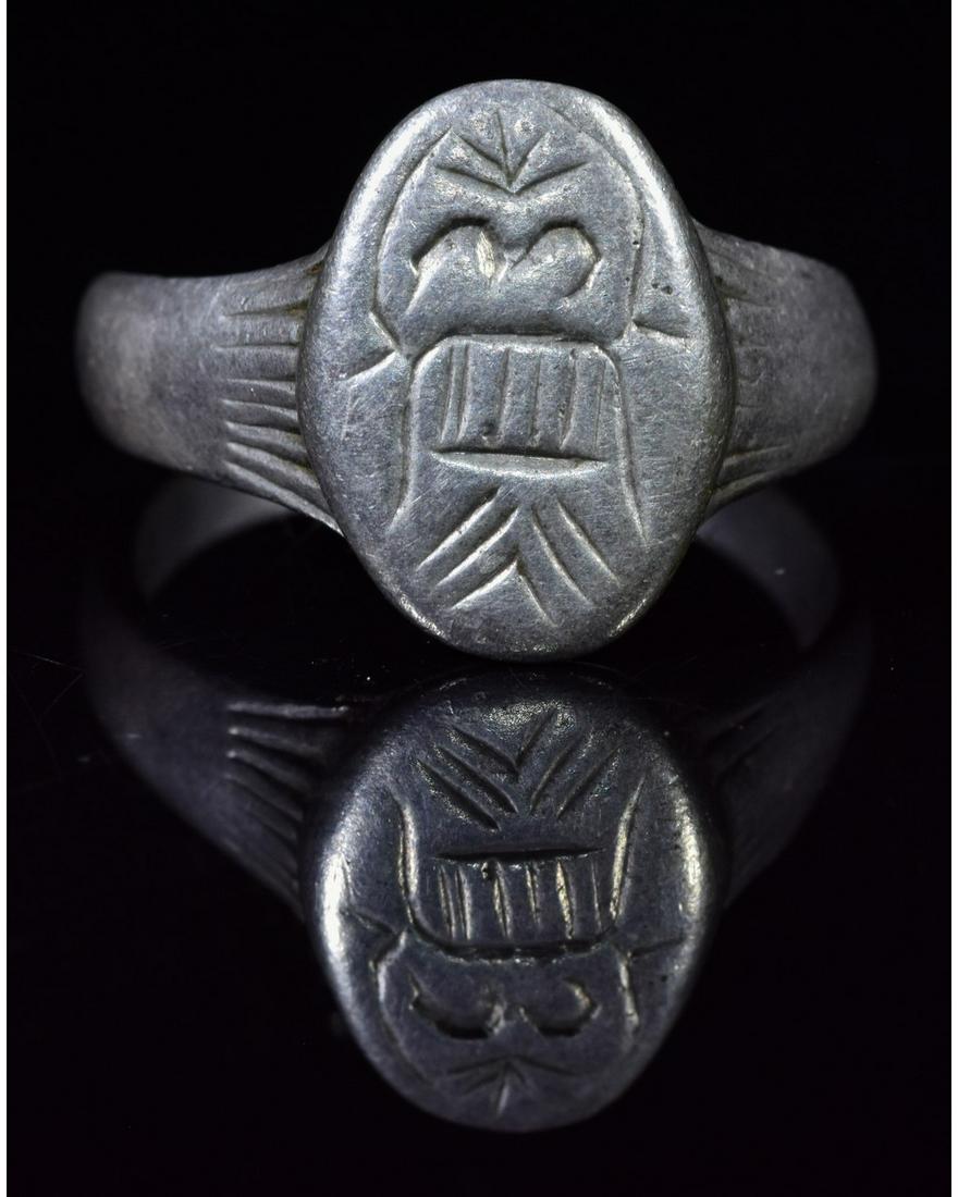 VIKING SILVER RING WITH FLYING BEAST: Ca. 700 - 900 AD. Rare Viking Silver Ring with stylized flying beast depicted on the bezel; Good Condition; wearable; Inner diameter: 20mm; outer diameter: 22mm ring size UK U; US 10; 7gr;Provenance: 
