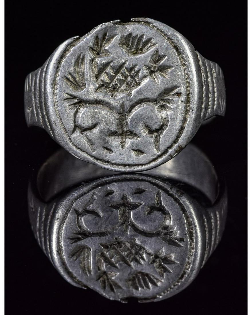 VIKING SILVER MYTHOLOGICAL RING DEPICTING YGGDRASIL: Ca.900 AD. Very Rare Viking Scandinavian Silver Ring depicting Yggdrasil, immense mythical tree that plays major role in the Norse cosmology, where it connects the nine worlds. Good Condition; wearabl