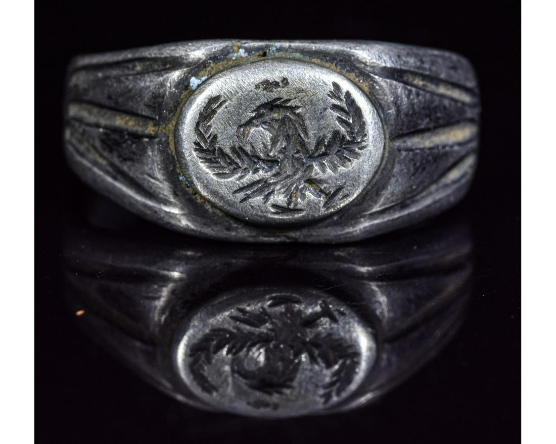 ROMAN SILVER LEGIONARY RING WITH EAGLE: Ca.200 AD. Interesting Roman Silver Ring with a oval shaped bezel depicting an Eagle. An "aquila" was a prominent symbol used in ancient Rome, especially as standard of a Roman legion. However it coul
