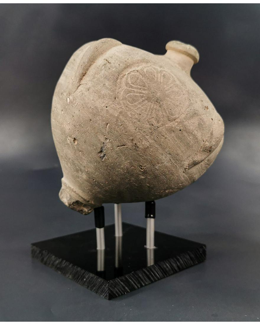 BYZANTINE GREEK FIRE GRENADE ON STAND: Ca.800 AD. A hollow Ceramic Vessel with barrel-shaped body, domed top and conical base, the body with a latticework design; knop to the upper face for the mouth; Good Condition; Size: 160x130mm; 6.3x