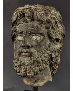 GANDHARA BRONZE HEAD OF GOD DIONYSUS WITH SILVER EYES: Ca.200 AD. Gandhara Bronze head of God Dionysus, Classical features with curly hair, wine vines forming head band, extremely detailed portrait, inlaid with silver eyes and copper lips, true amazing ex