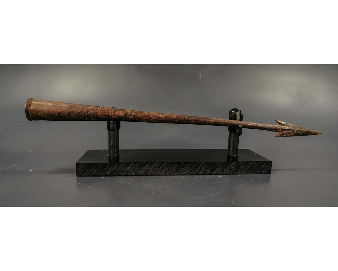 ROMAN LEGIONARY SPIKED IRON PILUM: Ca.200 A Beautiful socketed iron Pilum spear with inverted spikes for better grip when struck; on a custom made stand. Good Condition. 280mm; 11.02in; 95gr;Provenance: Private London collection, forme
