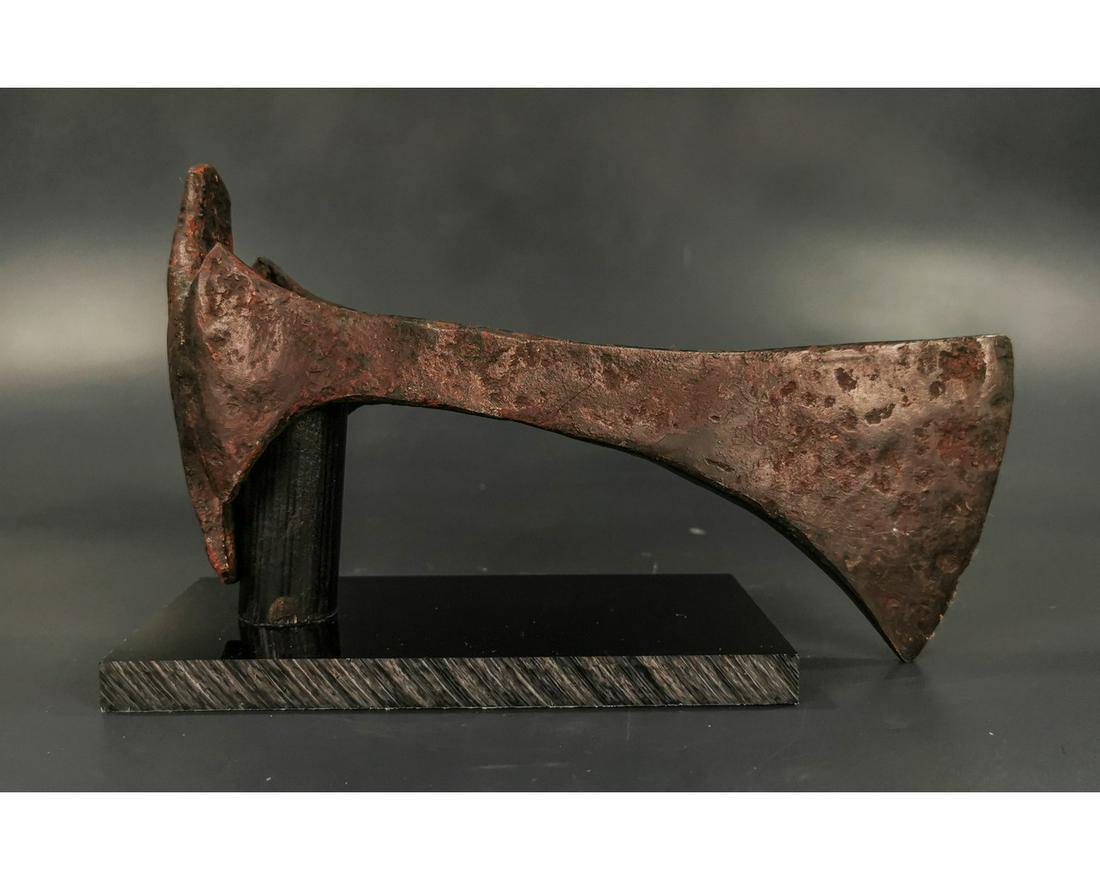 VIKING IRON BEARDED BATTLE AXE: Ca. 900 AD. Rare Medieval Scandinavian iron axehead with broad curved blade; Good condition; on a custom-made stand; 220x110mm; 8.66x 4.33in; 1255gr; Provenance: Old British collection of Ancient weap