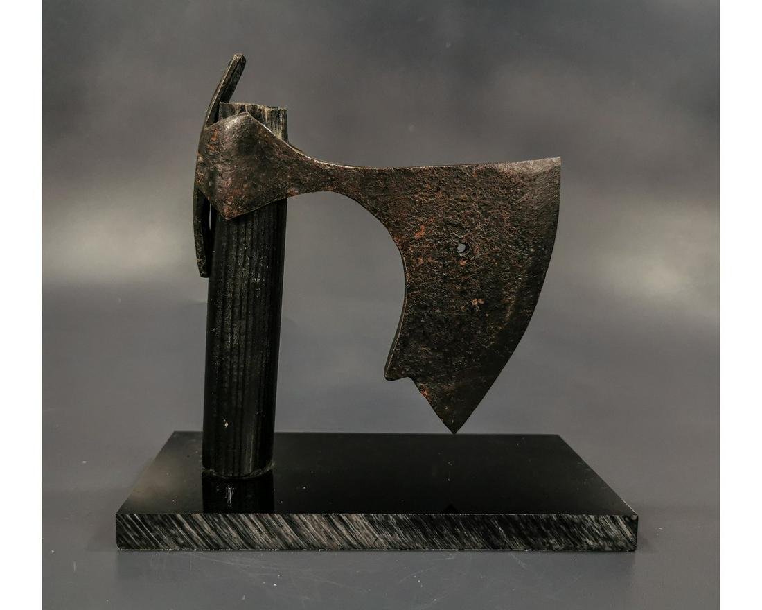 LARGE VIKING IRON BEARDED BATTLE AXE: Ca. 900 AD. Rare Medieval Scandinavian iron Axehead with broad curved blade; Good condition; on a custom-made stand. 120x100mm;Size: 4.72x 3.94in; 290gr; Provenance: Old British collection of Ancient 
