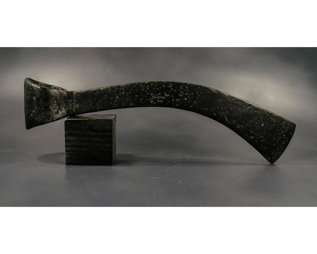 CELTIC IRON AGE BATTLE AXE: Ca. 200 BC Central / Northern Europe, Celtic Iron Age, iron axe-head mounted on a custom made stand. The metal is stable, sealed; composed by a circular shaft and a long thin head. Good Condition; Siz