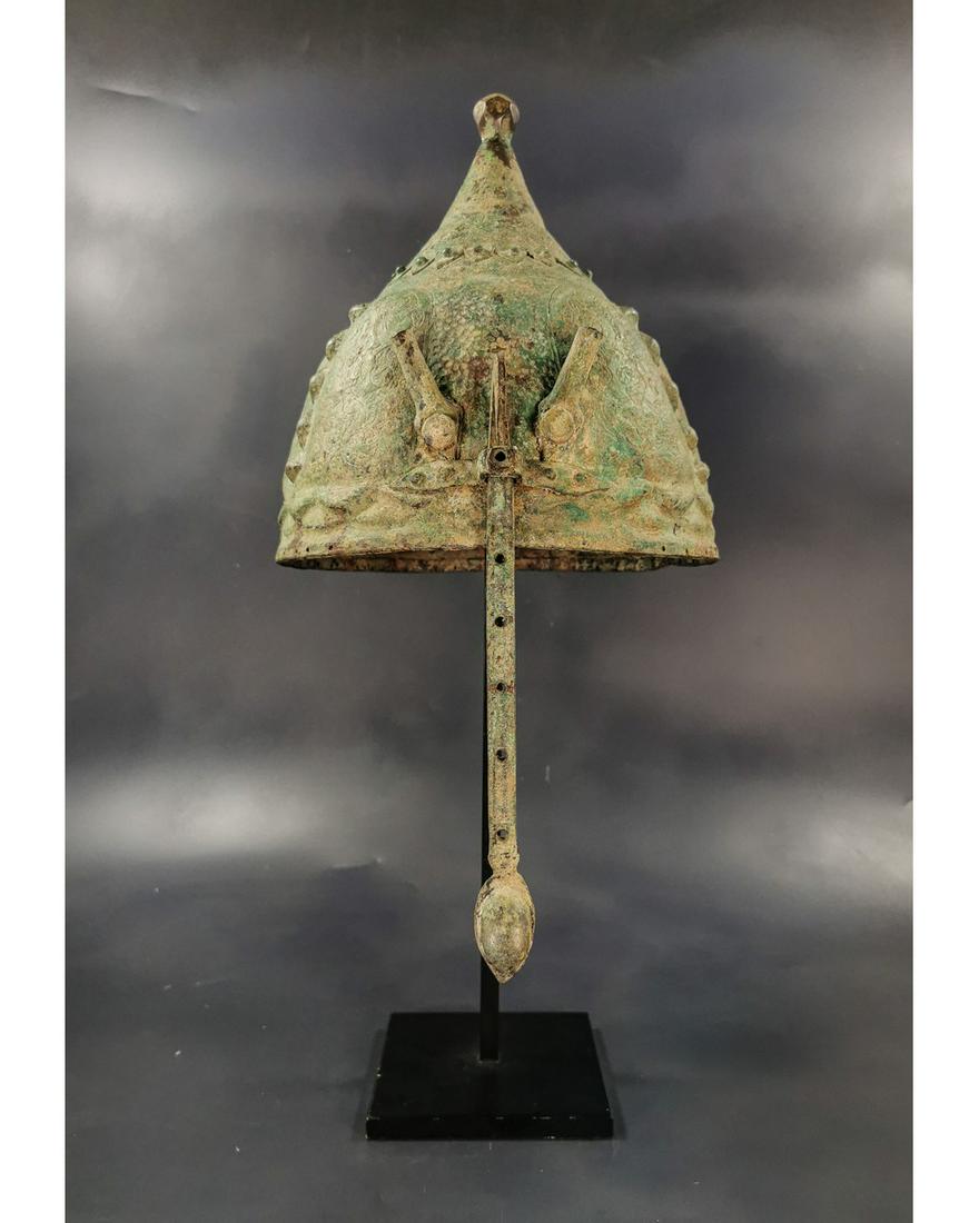SELJUK BRONZE DECORATED HELMET: Ca.1200 AD . Beautiful, Intact bronze Seljuk Bronze Helmet; with adjsutable nose guard, conical shape, and the inserted tube in the from part for attachment of feathers. Superb Condition, on custom ma