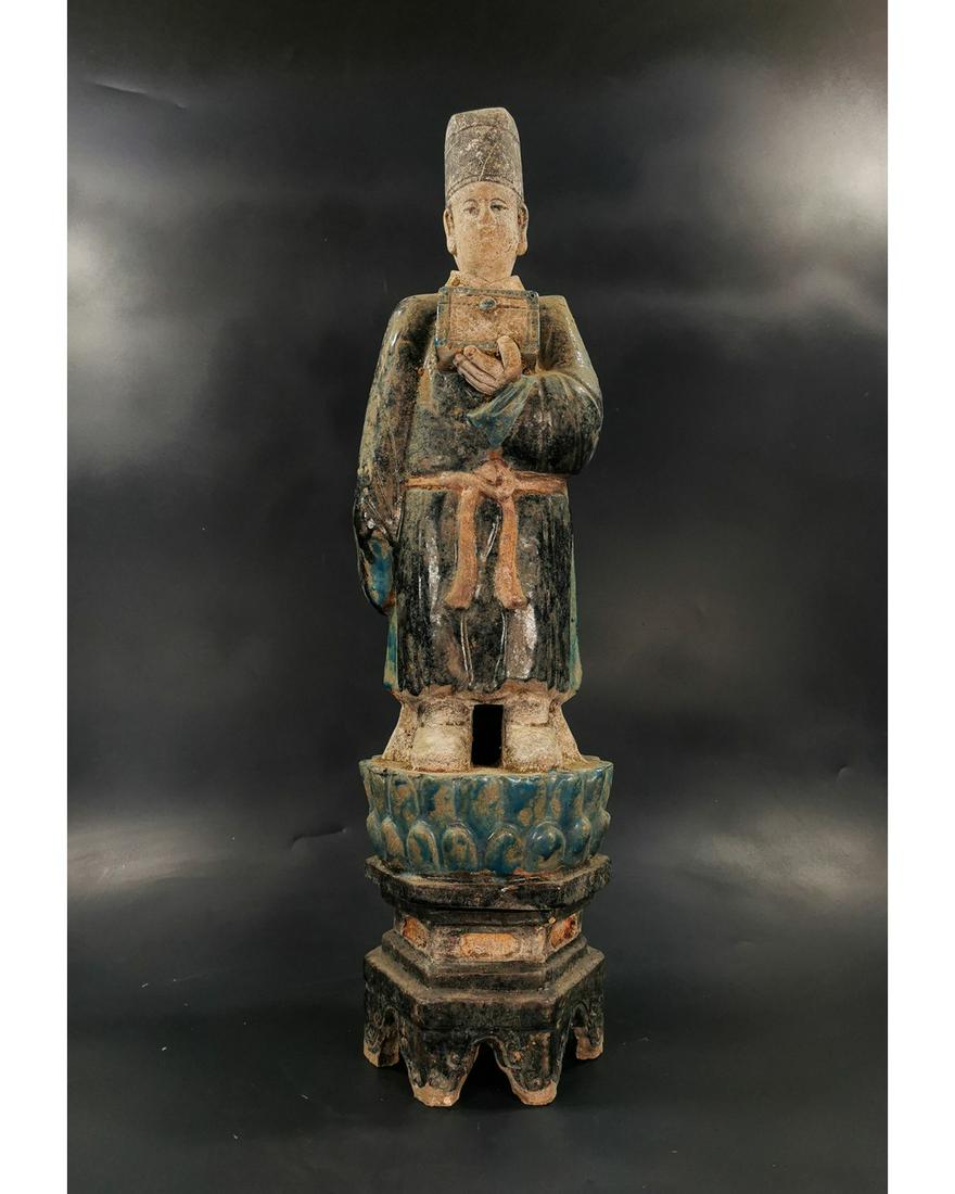 LARGE CHINESE MING DYNASTY ATTENDANT FIGURINE: Ca. 1368-1644 AD. Amazing Chinese Blue glazed Terracotta Male Attendant Figurine; with draped glazed blue robes, holding offering box on a lotus flower. Good Condition; Size: 580x140mm; 22.83x5.51in; 
