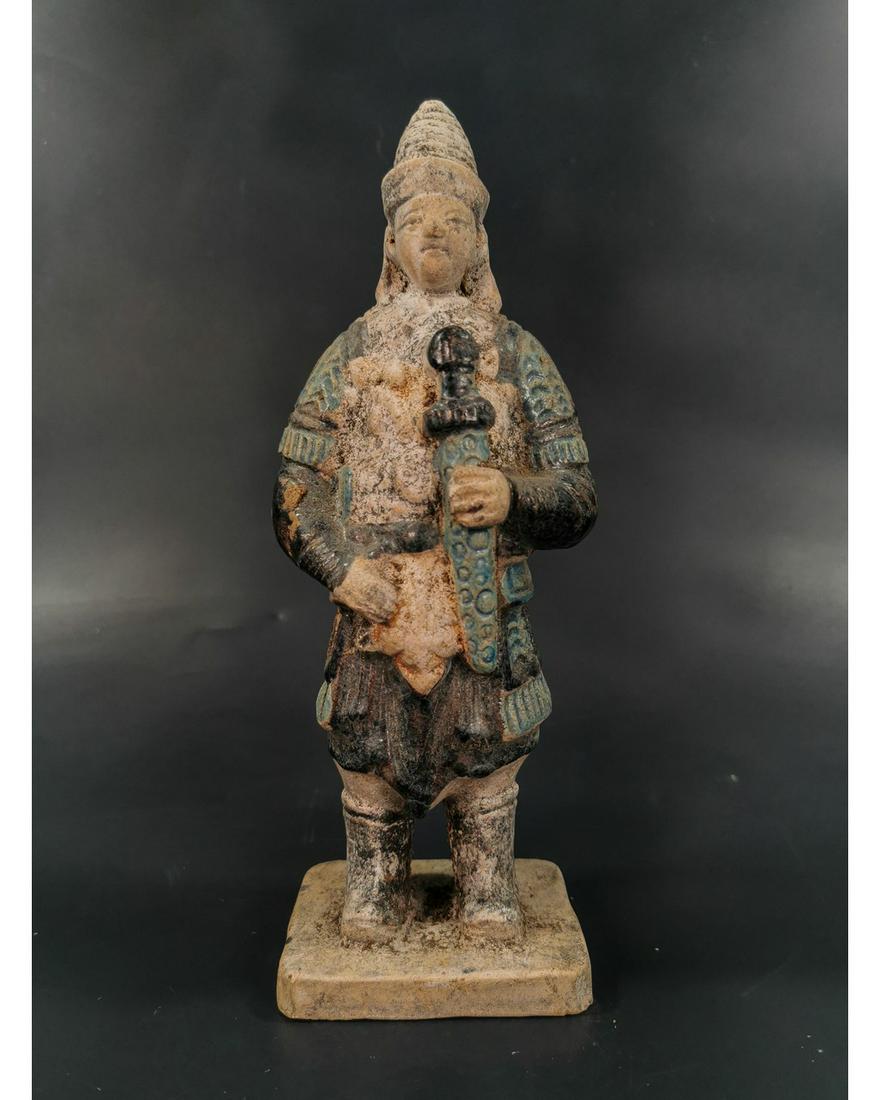CHINESE MING DYNASTY SOLDIER FIGURINE: Ca. 1368-1644 AD. Amazing Chinese Ming Dynasty cobalt blue glazed terracotta figurine. Male Warrior with armour and holding sword.Good condition, intact, original glazing;Size: 240x85mm; 9.45x 3.35in;
