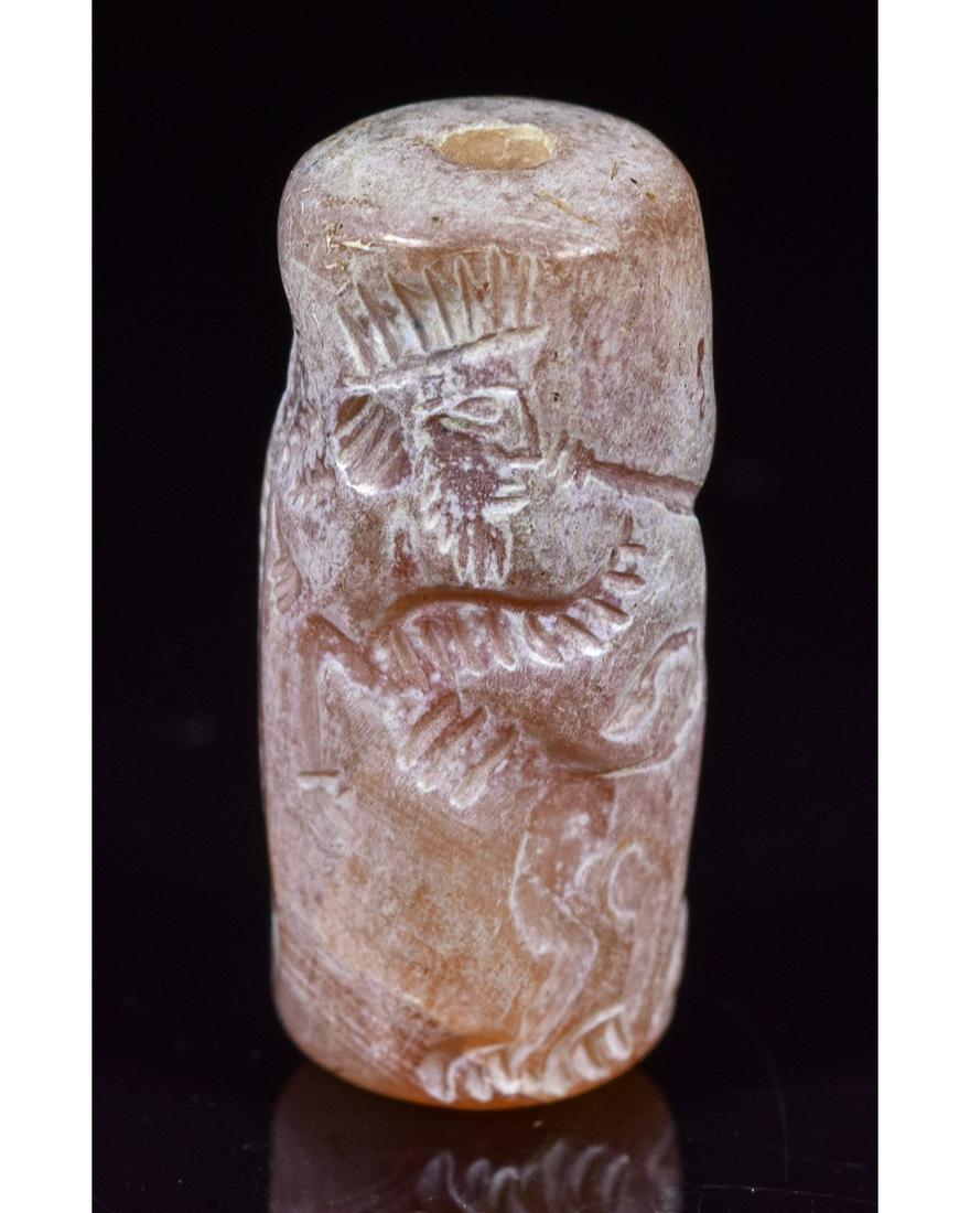 SASSANIAN CILYNDER CARNELIAN SEAL: Ca.500 AD. Sassanian carnelian seal depicting a mythology creature with bull's body, eagle wings and human head (Lamassu). Good Condition; 25x10mm 0.98 x0.39in; 5gr; Provenance: From an old British co