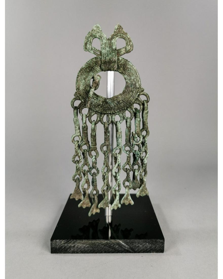 VIKING BRONZE BROOCH WITH DRAGONS AND TASSELS: Ca 900 AD. Interesting Medieval, Baltic brooch with stylized dragon heads; long chains with attached goose-feet tassels. H:210mm/190x80mm(without stand);8.27/7.48x3.15in; 355gr. Provenance: Property o