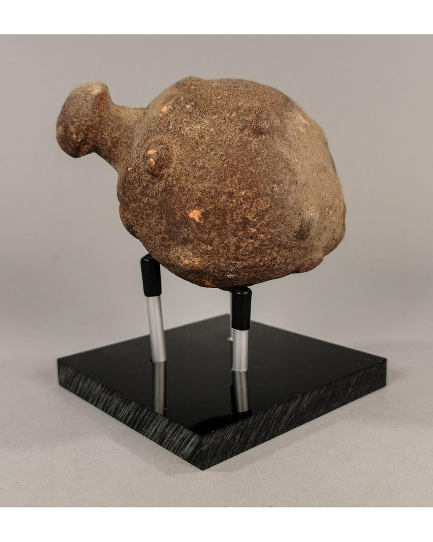 BYZANTINE GREEK FIRE GRENADE ON STAND: Ca.800 AD. A hollow ceramic Vessel with the barrel-shaped body, domed top, and conical base, knop to the upper face for the mouth; Good Condition; L:133mm/W:85mm; 5.31/ 3.35in; 330gr; Provenance: Priv