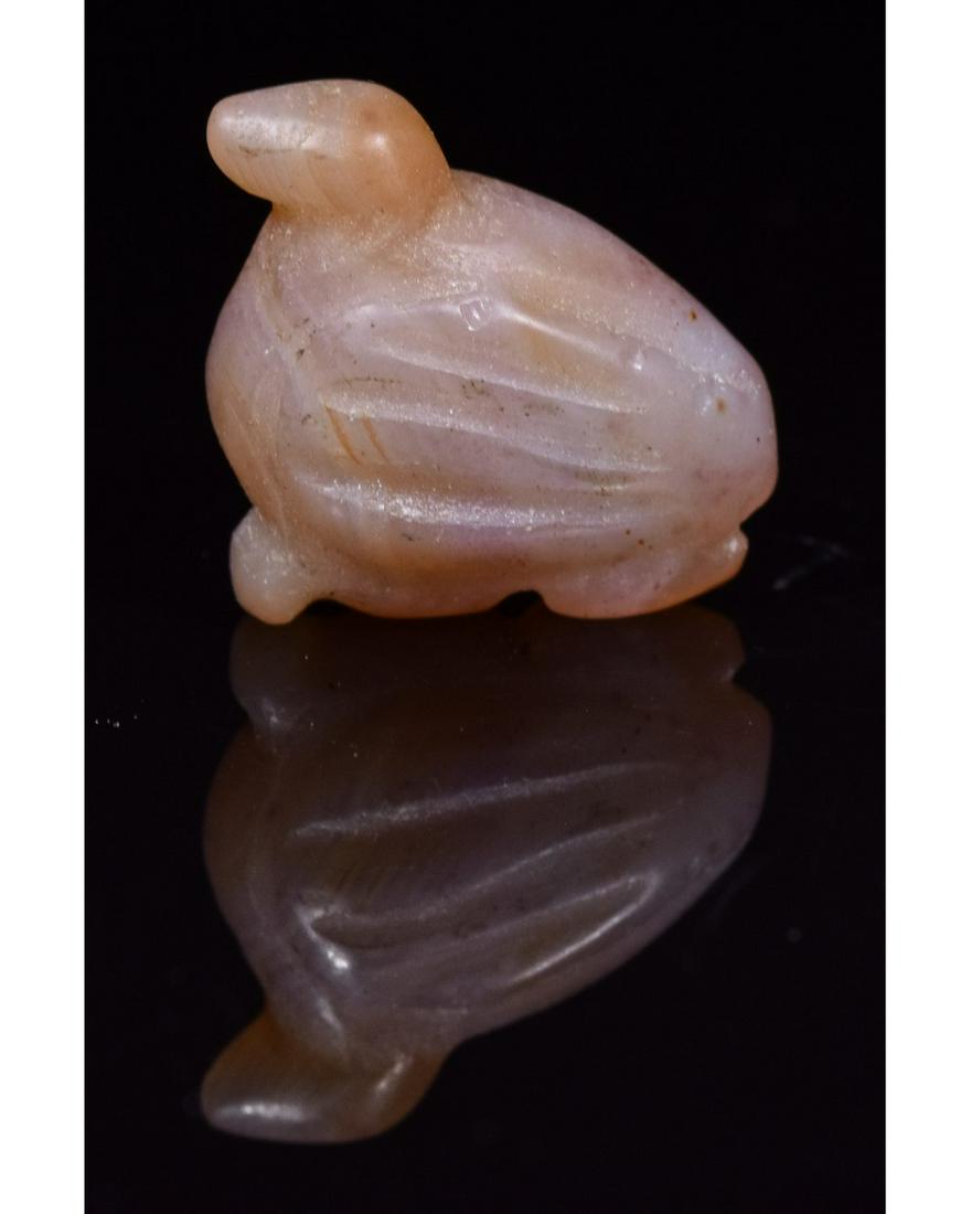 EGYPTIAN CARNELIAN BIRD AMULET: Ca. 1550-1070 BC. A carved carnelian amuletic bead of a bird; Good condition; 13mm0.51IN/ 2g; Provenance: Private London collection, formed in the 1990s on the UK and European art market, All Items so